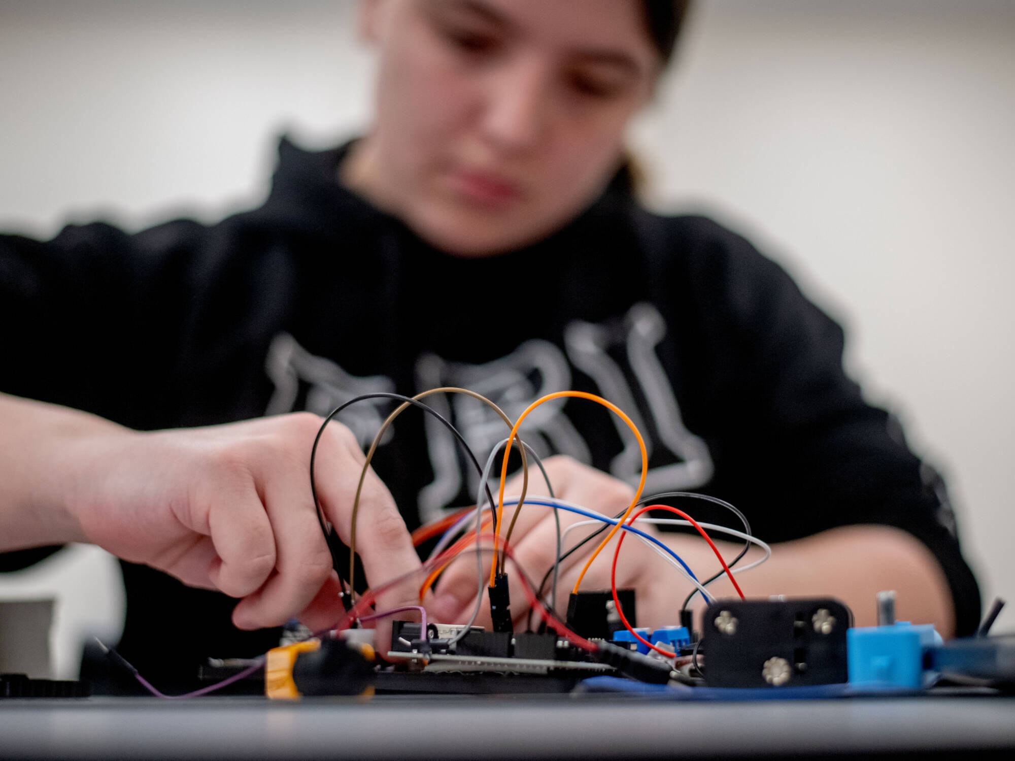 Student is building a robot in Engineering class